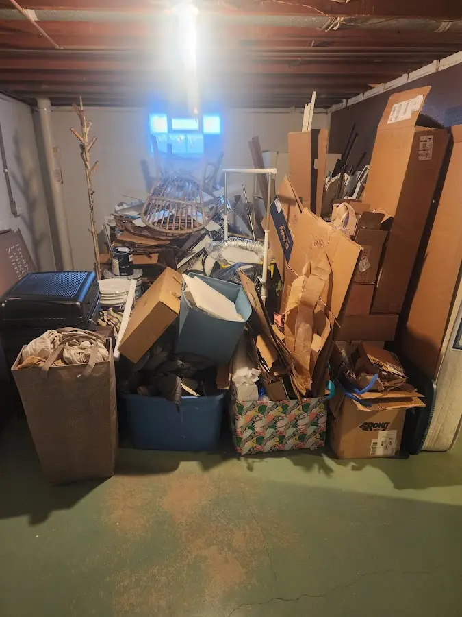 Roll-off dumpster container at job site for 2 Yard Dumpster Rental in Friendswood